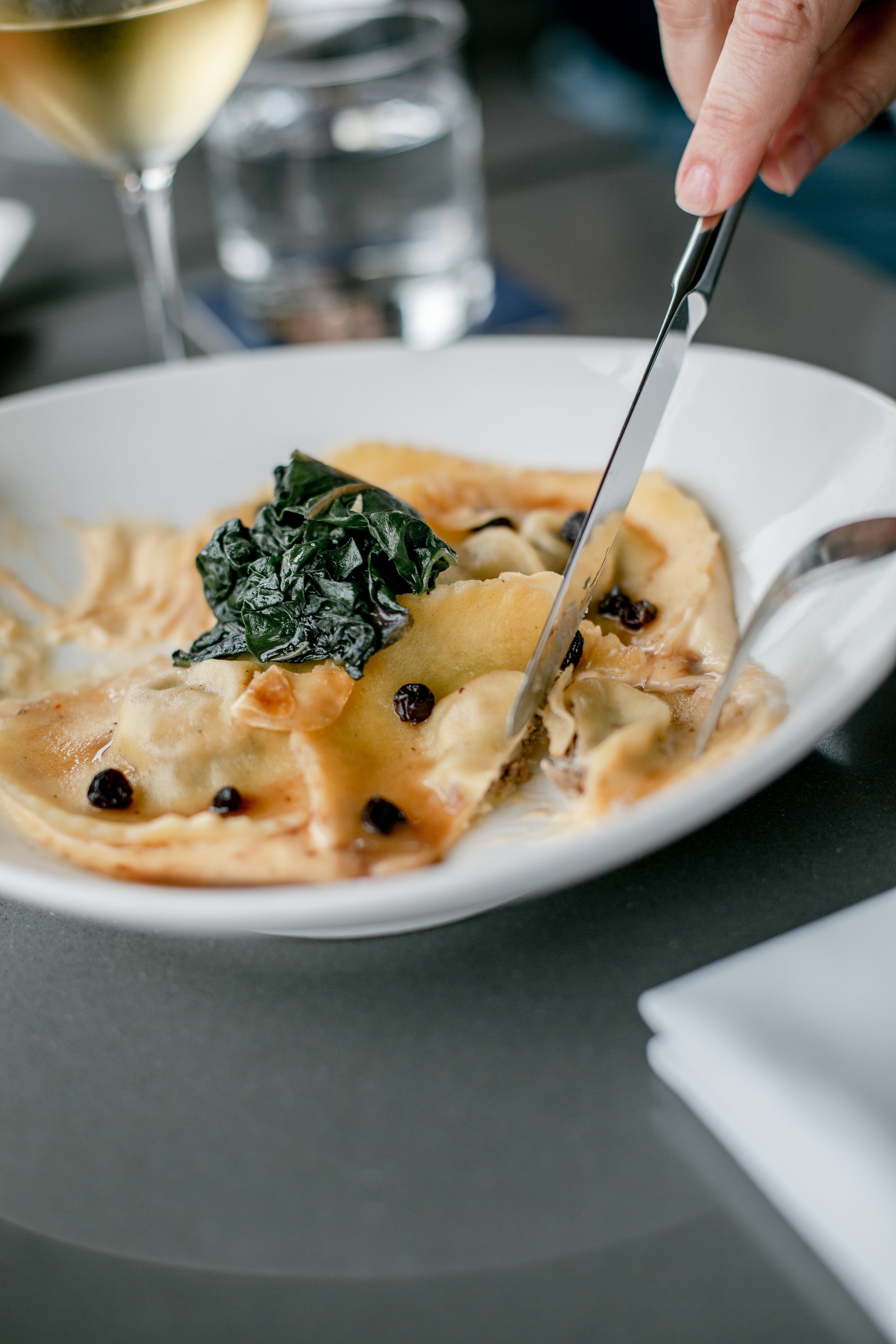files/person-cuts-into-plate-of-pasta.jpg